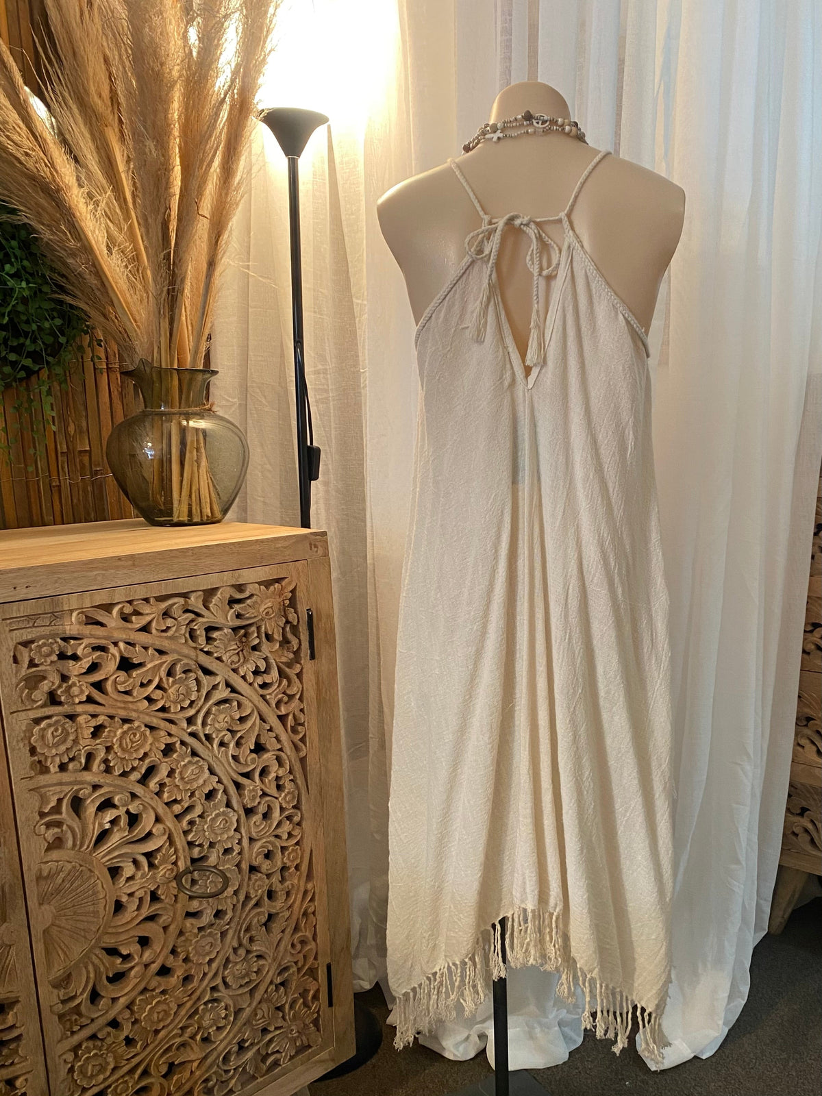 Back view of ramie dress with adjustable tie straps and open back with out the waist tie
