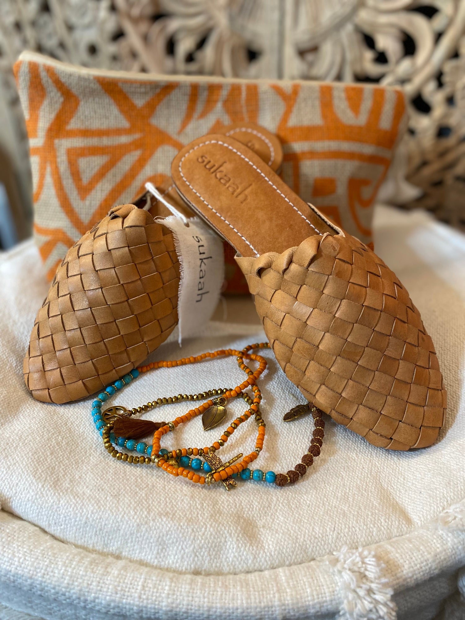 Women’s woven leather sandals in tan, flat summer footwear collection