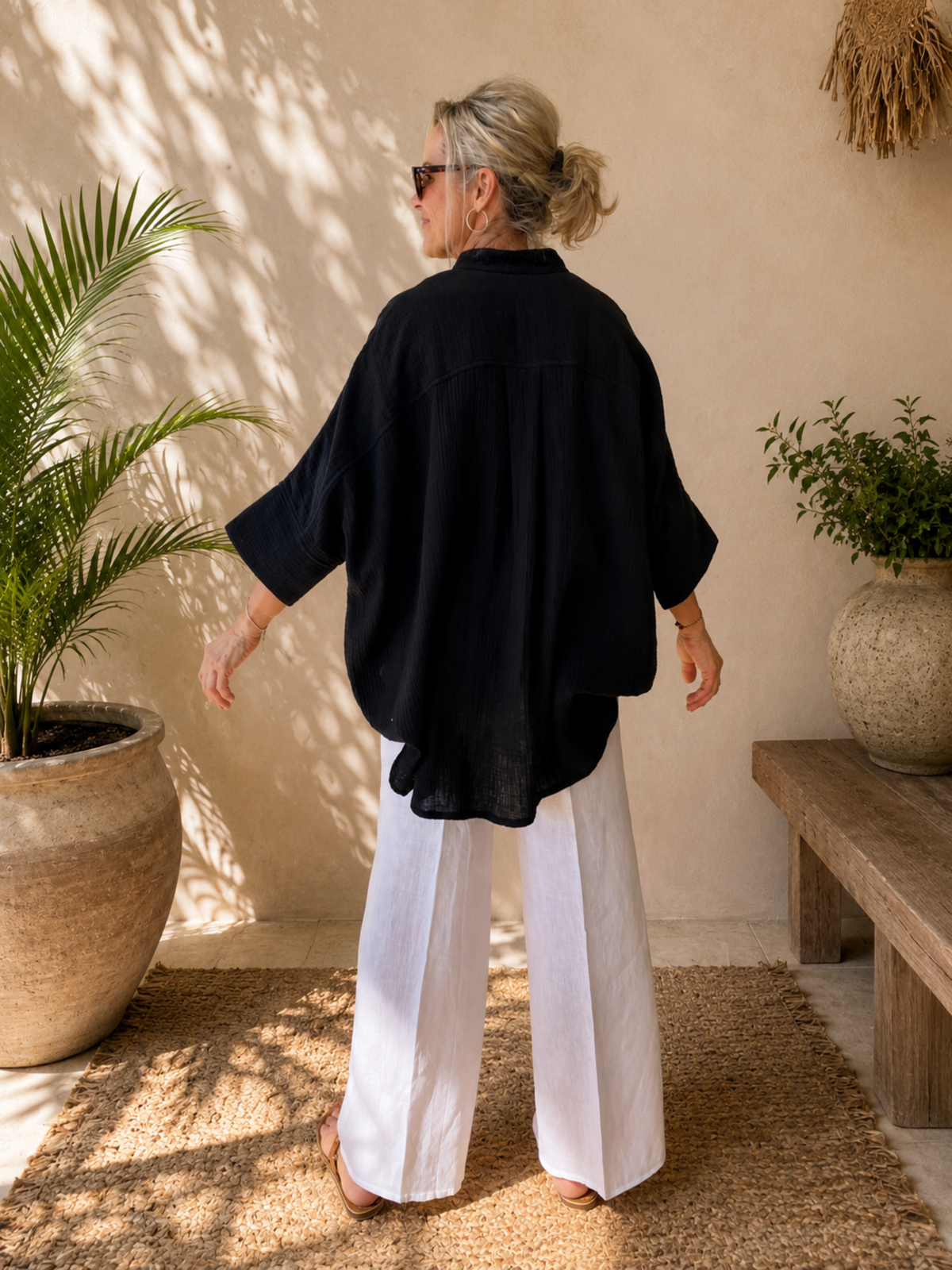 Coastal styling of oversized cotton crush shirt layered over singlet