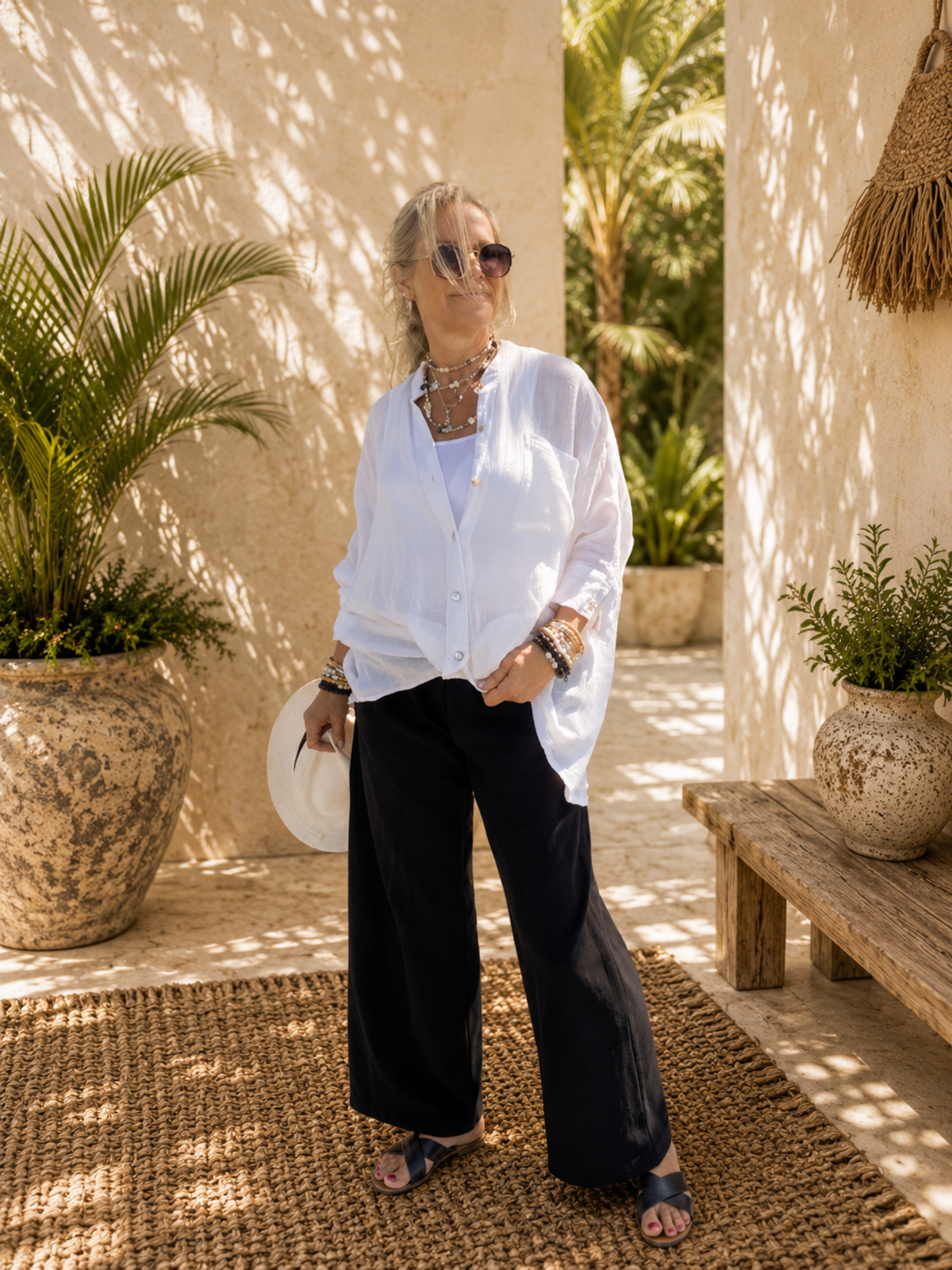 Relaxed oversized cotton crush resort shirt styled with black linen pants