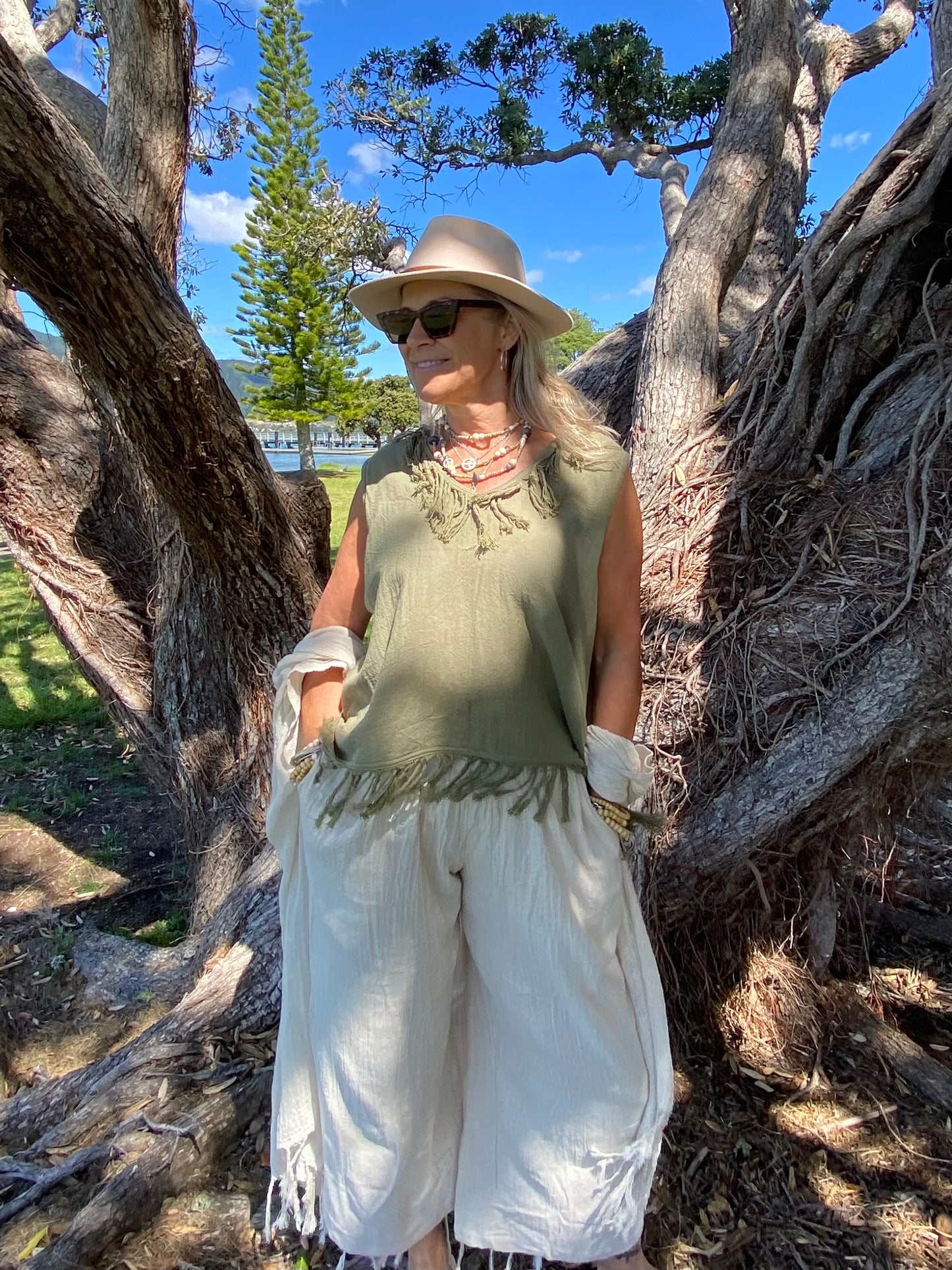 Natural ramie wide-leg women’s pants by SUKAAH featuring side pockets and lightweight relaxed silhouette