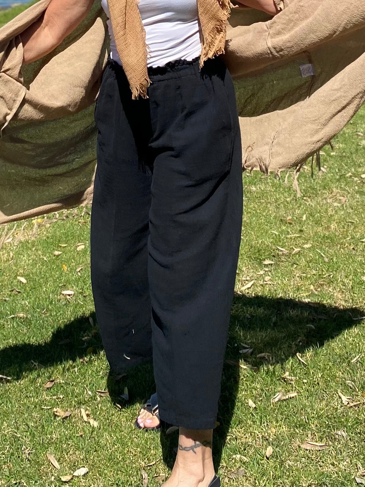 Sukaah women’s black  natural ramie trousers with soft drape and functional pockets.