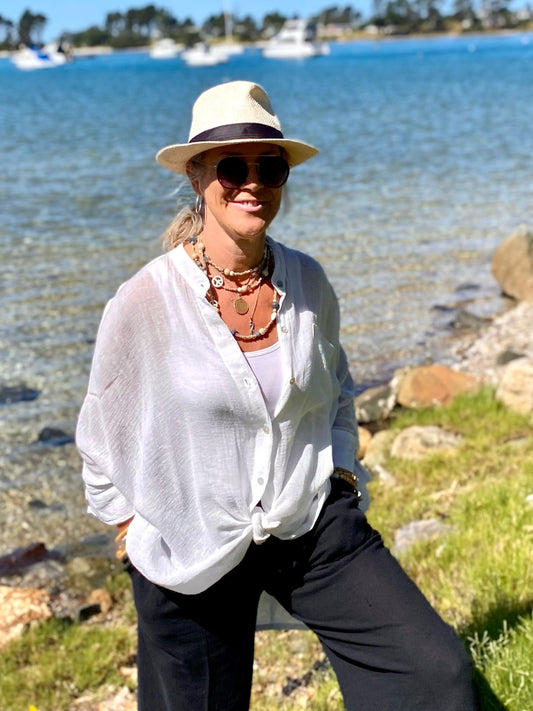 Relaxed oversized cotton crush resort shirt styled with black linen pants
