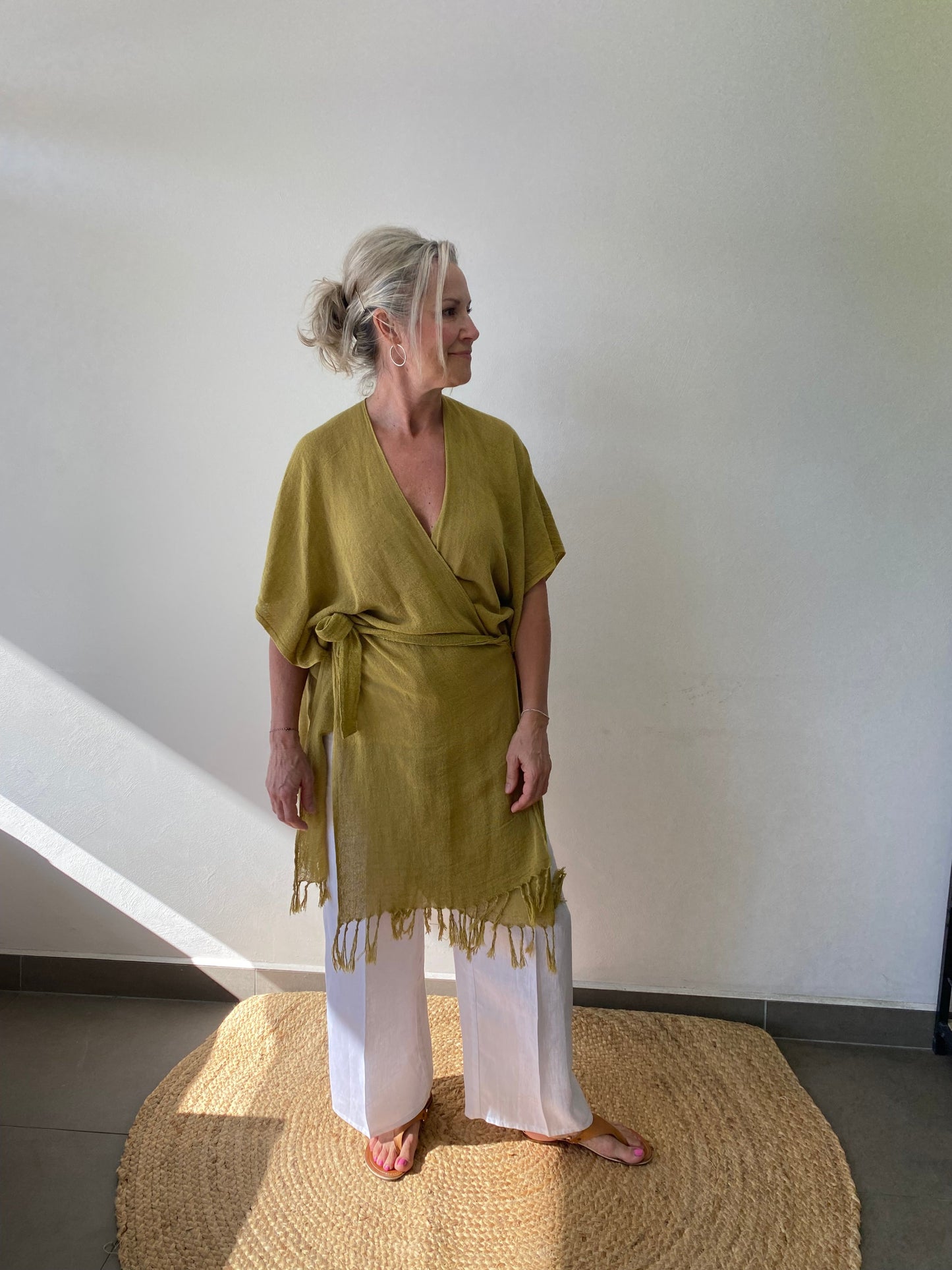 Sukaah sustainable ramie layering piece worn over swimwear and summer dresses.