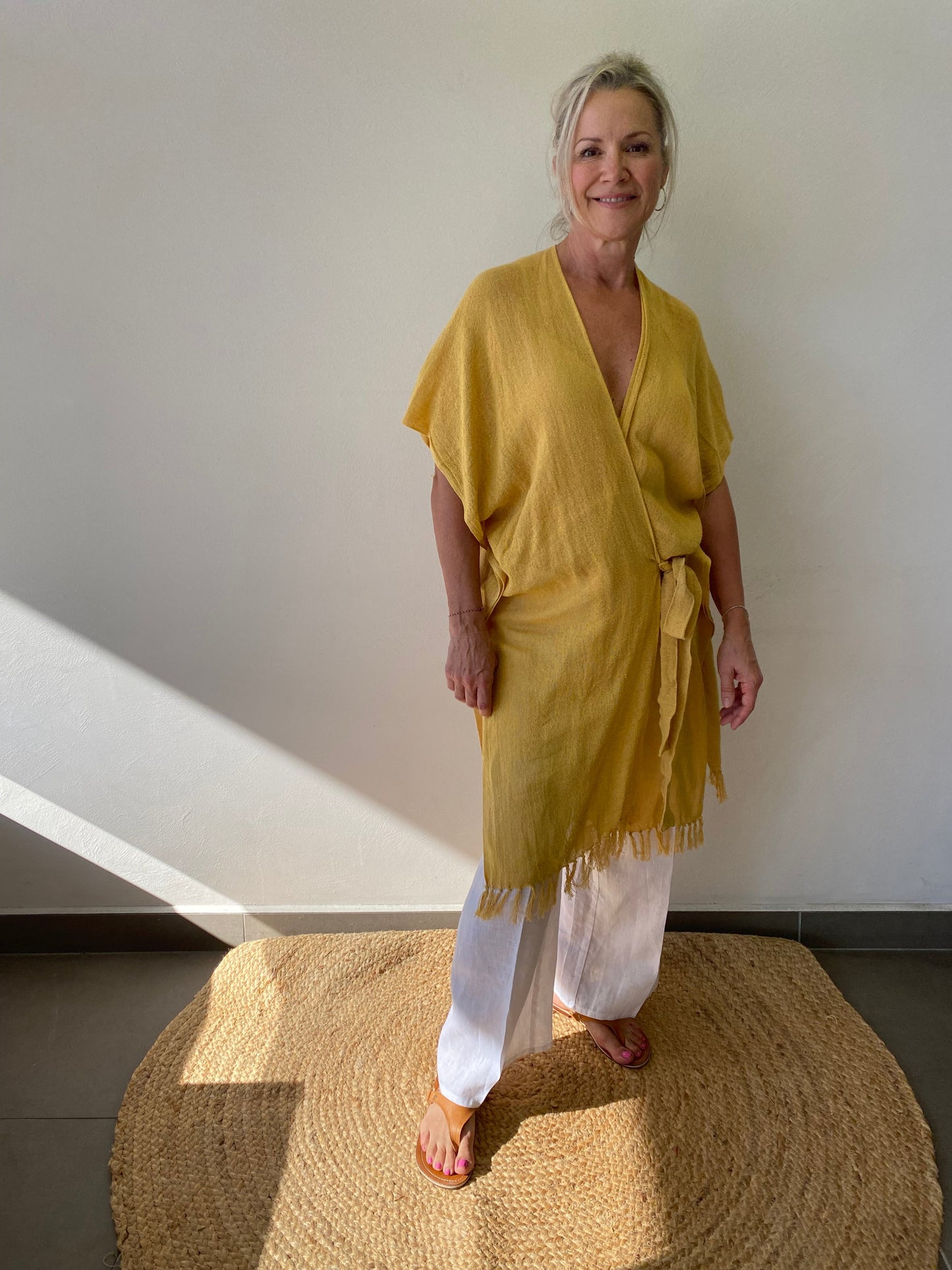 Sukaah artisan ramie wrap styled for understated sustainable resort wear.