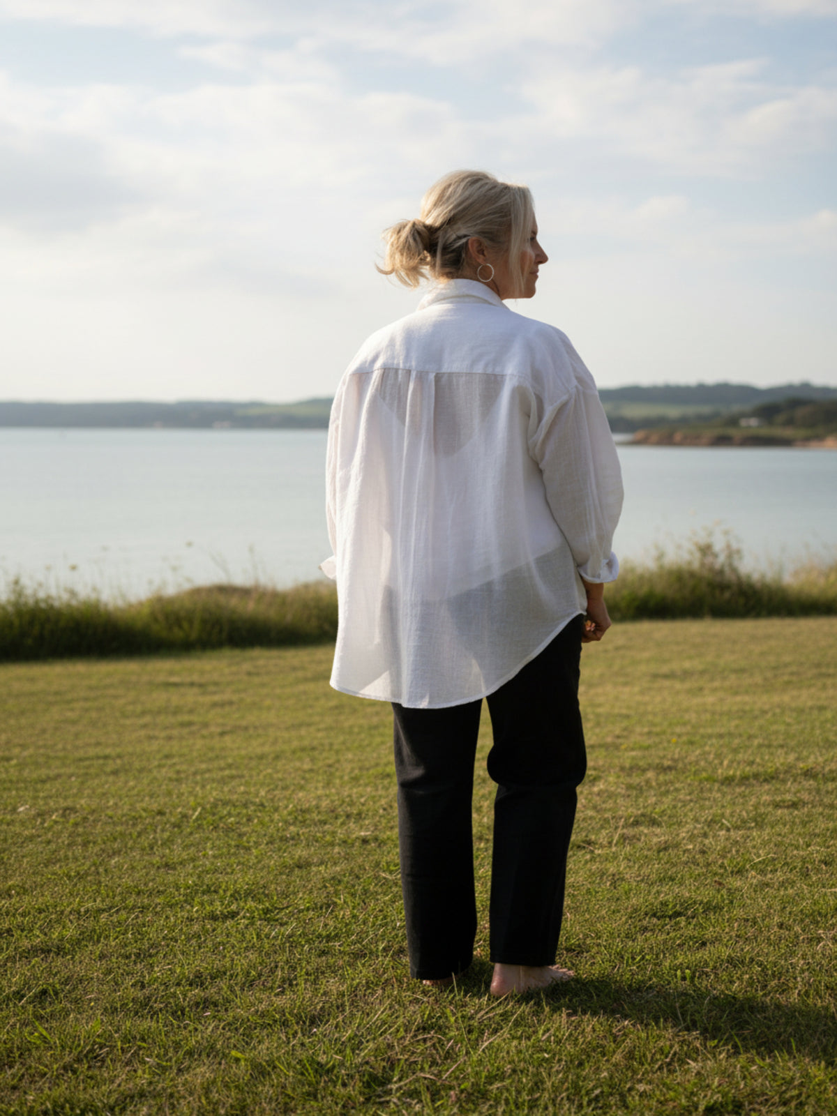 Oversized white linen shirt, perfect for layering over other garments , and warm climates 